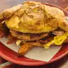 Breakfast Sandwich #3 — Croissant with sausage, bacon, or ham, plus egg and cheese
