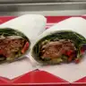 Heron Chicken Wrap — Whole wheat wrap or garden spinach herb wrap, chicken, lettuce, tomatoes, onions, cheese, green & red peppers, ranch, and thousand island