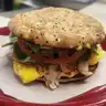 Power Breakfast Special — Multigrain roll with egg, avocado, turkey, tomato, swiss cheese, and spinach